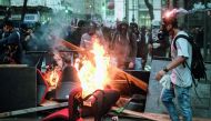 Protesters burn items looted from offices during the nationwide strike called by unions opposing austerity reforms in Rio de Janeiro
