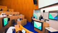 Students from College of Science and Engineering defending  their theses at a program at HBKU.