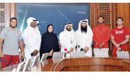 The General Secretary of Qatar Athletics Federation (QAF) Mohammed Issa Al Fadala (centre), Assistant Director of National and Board Member of QAF, Khalid Rashid Al Marri (third right), retired Qatari sprinter Talal Mansour (second left), and other Qatari