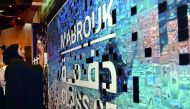 HE Sheikha Hind bint Hamad Al Thani places photos on the HBKU graduation social media mosaic.