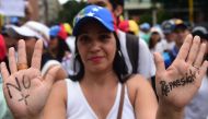 Led by opposition leaders and Lilian Tintori, wife of jailed opposition leader Leopoldo Lopez, thousands of women marched through Caracas to pressure President Nicolas Maduro (AFP Photo/RONALDO SCHEMIDT).
