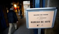An official arrives at a polling station before the polls open for the second round of 2017 French presidential election in Paris, France, May 7, 2017. REUTERS/Jean-Paul Pelissier REUTERS.