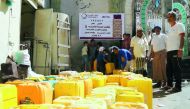 People collect water from a project supported by Qatar Charity in cooperation with Sobol Charity in Yemen's Taiz.