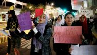 Protesters chant during a rally against travel ban at San Diego International Airport, on March 6, 2017 (AFP Photo/Sandy Huffaker)
