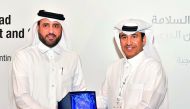 CENG Dean and QTTSC Director Dr Khalifa Al Khalifa (right) and Ministry of Transport and Communications Assistant Undersecretary for Land Transport Rashid Taleb Al Nabit.