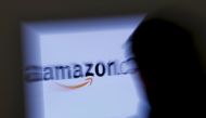 FILE PHOTO: A zoomed illustration image of a man looking at a computer monitor showing the logo of Amazon is seen in Vienna, Austria, on November 26, 2012. REUTERS/Leonhard Foeger/File Photo
