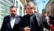 Far-right Front National (FN) party member of parliament Gilbert Collard (R) arrives at 