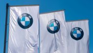 Flags with the BMW logo are pictured prior to the annual general meeting in Munich on May 11, 2017.  AFP / Alexander Heinl

