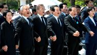 South Korean President Moon Jae-In (3L) attends the annual Democratic uprising memorial at the Gwangju National Cemetery, in the southwestern city of Gwangju on May 2017, as the government holds an annual ceremony to mark the 37th anniversary of a pro-dem