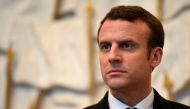 French President Emmanuel Macron waits to welcome the European Council president at the Elysee presidential Palace in Paris on May 17, 2017. / AFP / STEPHANE DE SAKUTIN?
