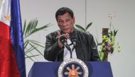 Philippine President Rodrigo Duterte gestures as he speaks shortly after arriving in Davao on May 16, 2017, from a working visit to China.   AFP / MANMAN DEJETO
