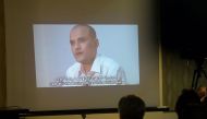 (FILES) This file photo taken on March 29, 2016 shows Pakistani journalists watching a video showing Indian national Kulbhushan Yadav, arrested on suspicion of spying, during a press conference in Islamabad. India on May 15, 2017 appealed to the UN's top 