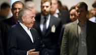 Brazilian President Michel Temer arrives to make a statement at Planalto Palace in Brasilia, Brazil, on May 20, 2017. AFP / EVARISTO SA
