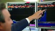 A  stock broker reading the market trend at the Bloomberg terminal in this photo.   The rise of the Symphony system has been portrayed as a threat to the Bloomberg terminal's dominance in trading rooms.