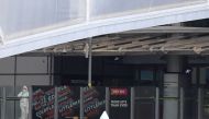 A police forensic officer stands by one of the entrances to the Manchester Arena, scene of a terror attack during a pop concert by US star Ariana Grande in Manchester, northwest England on May 23, 2017. AFP / Paul ELLIS
