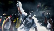 Opposition activists clash with riot police during a protest against the government of President Nicolas Maduro in Caracas on May 20, 2017. Photo: JUAN BARRETO / AFP.