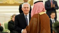 FILE PHOTO: US Secretary of State Rex Tillerson (C) shakes hands with a participant at the Royal Court in Riyadh, Saudi Arabia May 20, 2017. REUTERS/Jonathan Ernst/Files