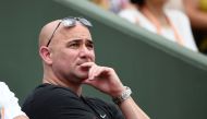 US coach Andre Agassi watches Serbia's Novak Djokovic playing against Spain's Marcel Granollers during their tennis match at the Roland Garros 2017 French Open on May 29, 2017 in Paris. (AFP / GABRIEL BOUYS)