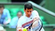 Serbia's Novak Djokovic in action during his first round match against Spain's Marcel Granollers yesterday.
