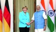 Chancellor Angela Merkel (left) shakes hand with India's Prime Minister Narendra Modi.