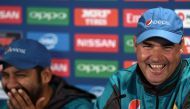 Pakistan coach Mickey Arthur (R) and captain Sarfraz Ahmed share a light moment during a press conference at Edgbaston cricket ground in Birmingham on June 3, 2017, ahead of the ICC Champions Trophy cricket match between Pakistan and India. (AFP / Paul EL