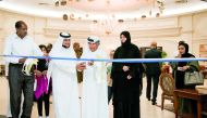 Officials cutting the ribbon at the opening of 'Layali Al Khair' at Qafco’s Al-Banush Club in Mesaieed. 