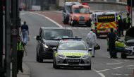A Police coroners's van is driven onto London Bridge in London on June 4, 2017, as police continue their investigations following the June 3 terror attack.  AFP / Daniel LEAL-OLIVAS
