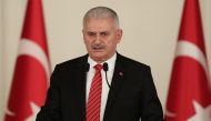 Turkish Prime Minister Binali Yildirim delivers a speech during the iftar meeting with representatives of workers, civil servants unions at Cankaya Palace in Ankara, Turkey on June 1, 2017. Turkish Prime Ministry / Mustafa Aktas / Anadolu Agency