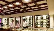 This picture taken on May 24, 2017 shows salesmen waiting for customers at a gold jewelry shop in Dhaka