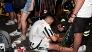  June 3, 2017 A Juventus' fan receives first aids as the fans gathered in San Carlo Square run away following panic created by the explosion of firecrackers as they was watching the match on a giant screen. REUTERS/Giorgio Perottino

