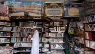 A man reads a book at a bookshop in Bab Doukkala in the city of Marrakech, Morocco May 13, 2017. Reuters/Youssef Boudlal