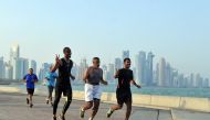 File picture of joggers on Corniche used for representation. 