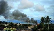 Smoke rises after aerial bombings by Philippine Air Force planes on militant positions in Marawi, on the southern Philippine island of Mindanao, yesterday.

