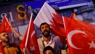File picture of people shouting slogans as they hold Turkish and Qatari flags during a demonstration in favour of Qatar in central Istanbul, Turkey, late June 7, 2017. REUTERS/Murad Sezer

