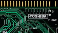 A logo of Toshiba Corp is seen on a printed circuit board in this photo illustration taken in Tokyo July 31, 2012. REUTERS/Yuriko Nakao/File Photo