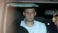 Russian opposition leader Alexei Navalny sits in a police car after being found guilty by a court of repeatedly violating the law on organizing public meetings, in Moscow, Russia, June 13, 2017. REUTERS/Sergei Karpukhin
