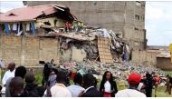 Rescue workers search debris after a seven-storey building collapsed in a residential area in Nairobi, Kenya on June 13, 2017. ( Andrew Wasike - Anadolu Agency ).