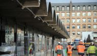 This file photo taken on October 18, 2016 shows workers walking through the construction site of the world-biggest start-up incubator Station F, formerly known as the Halle Freyssinet in Paris (AFP / Lionel Bonav) 