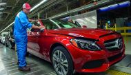 An employee does final inspections on a Mercedes-Benz C-Class at the Mercedes-Benz US International factory in Vance, Alabama. US President Donald Trump's harsh criticism of Germany's trade practices is sowing concerns in rural, Republican Alabama, where 
