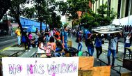 Alejandro Humboldt University students block the street with desks during protests against the National Constituent Assembly prompted by Venezuela's President Nicolas Maduro government, at Romulo Gallegos Avenue in Caracas, yesterday. Near-daily protests 