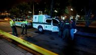 Police officers stand behind a yellow tape outside the Andino shopping center after an explosive device detonated in a restroom, in Bogota, Colombia June 17, 2017. REUTERS/Jaime Saldarriaga.