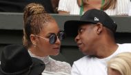 (FILES) This file photo taken on July 9, 2016 shows US singer Beyonce (L) and her husband US rapper Jay Z (R) sitting in the players box to watch Serena Williams play against Germany's Angelique Kerber during the women's singles final of the 2016 Wimbledo