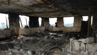 Handout picture released by the Metropolitan Police showing the inside of the Grenfell Tower in west London on June 16, 2017 after a fire engulfed the 24-storey building on Wednesday. / AFP.