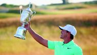 Brooks Koepka of the United States poses with the winner's trophy after his victory at the US Open at Erin Hills in Hartford, Wisconsin on Sunday.