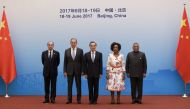 Brazil's Foreign Minister, Aloysio Nunes (left), Russia's Foreign Minister Sergei Lavrov (second left), South Africa's Foreign Minister, Maite Nkoana-Mashabane (second right), and Indian Minister of External Affairs, Vijay Kumar Singh (right) pose with Ch
