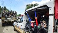 Members of the Philippine police special action force make their way to the frontline in Marawi on the southern island of Mindanao on June 19, 2017, as the armed conflict between government troops and Islamist militants enters its fourth week. AFP / Ted A