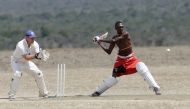 Daniel Mamai of the Maasai Cricket Warriors plays against the British Army Training Unit (BATUK) cricket team during a charity tournament called the 