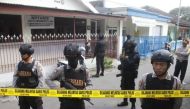 Police stand guard near the home of a suspected militant, following his arrest in Singosari District, Malang, Indonesia June 19, 2017. Picture taken June 19, 2017. Antara Foto/Ari Bowo Sucipto via REUTERS.
