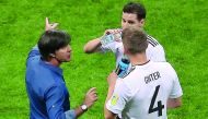 Germany's coach Joachim Loew (left) speaks to Germany's defender Matthias Ginter during the 2017 Confederations Cup group B match against Chile at the Kazan Arena Stadium in Kazan on Thursday.
