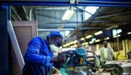 A worker cuts wood at the Furntech Workshop where designers and manufacturers rent out equipment and space to manufacture their products in Johannesburg. Soweto's cottage industries are being transformed from individuals making small quantities for local 